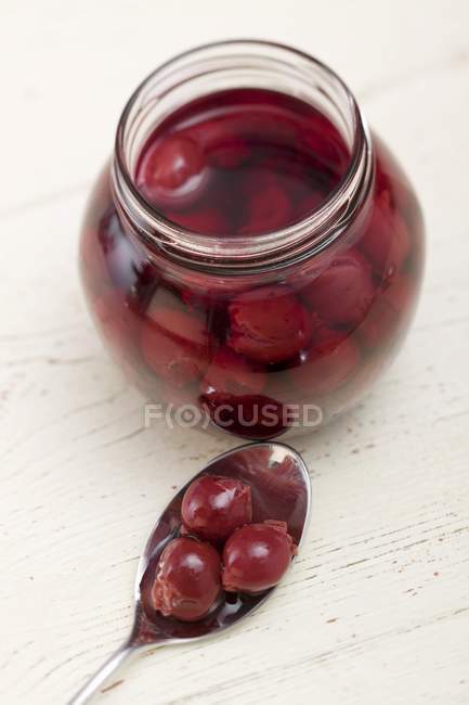 Cherry compote in jar — Stock Photo
