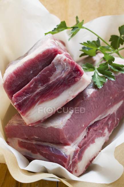 Fresh beef pieces with parsley — Stock Photo