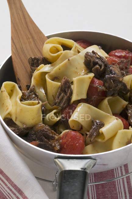Pappardelle pasta with oxtail and tomatoes — Stock Photo