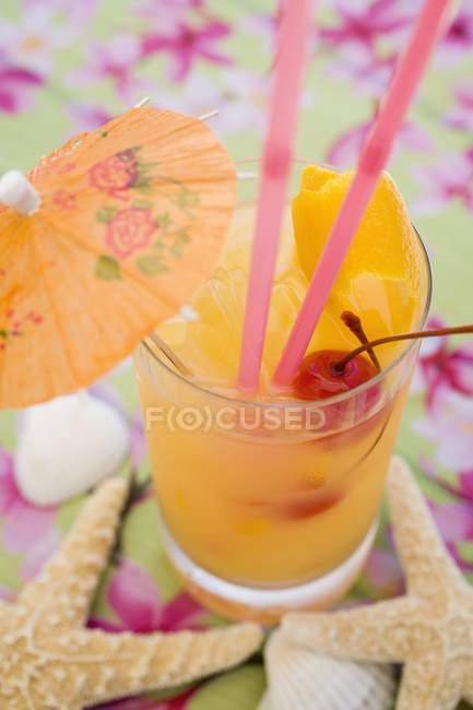 Fruity cocktail with peel — Stock Photo