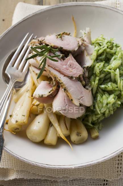 Rolled pork roast with parsley roots — Stock Photo