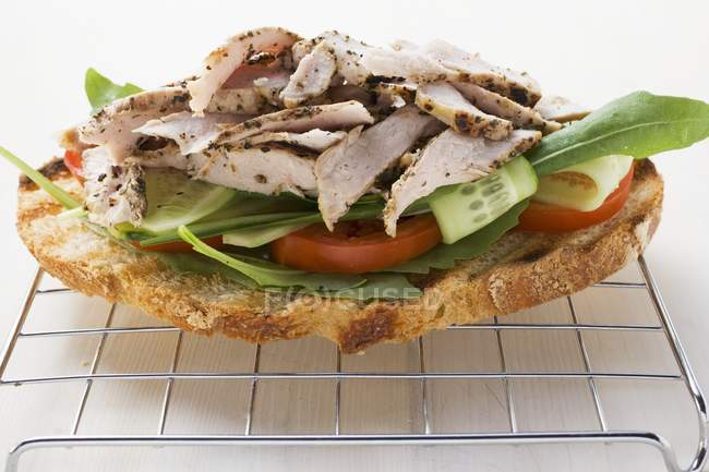 Toasted bread with pork — Stock Photo