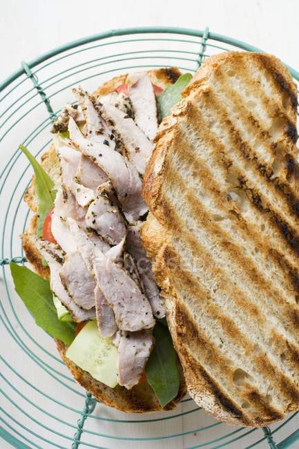 Toasted bread with pork — Stock Photo