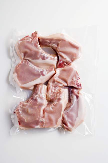 Schweinekoteletts vakuumverpackt — Stockfoto