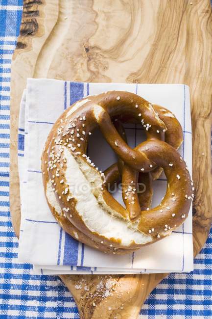 Soft pretzels on tea towel — Stock Photo
