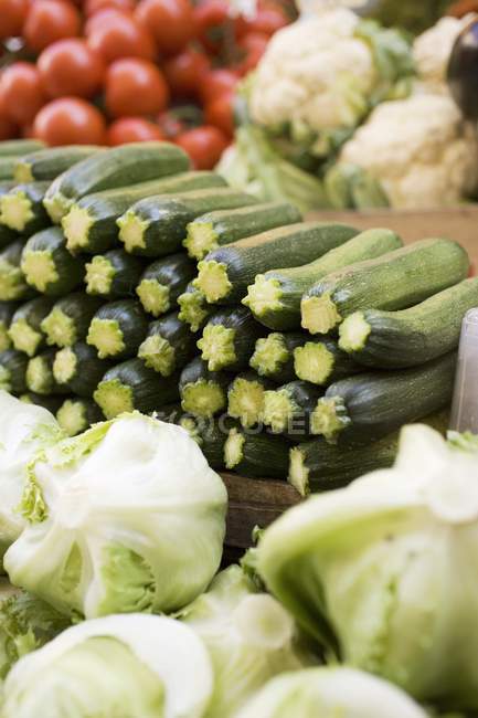 Courgettes with lettuces and cauliflower — Stock Photo