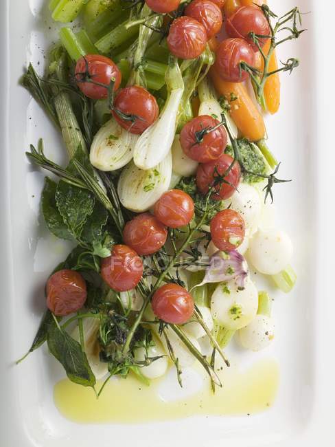 Roasted cherry tomatoes with celery — Stock Photo