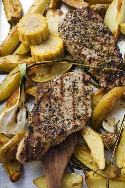 Grilled pork chops with fried potatoes — Stock Photo