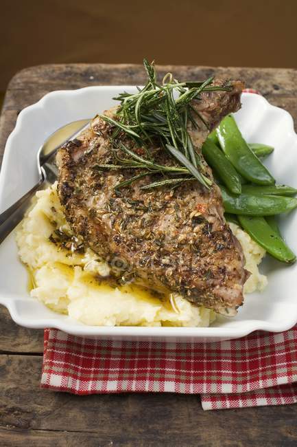 Spicy pork chop on mashed potatoes — Stock Photo