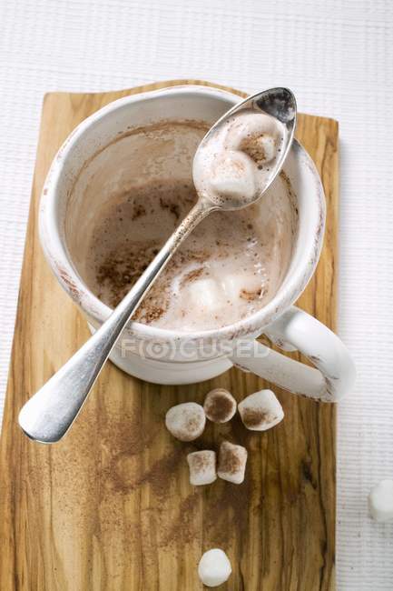 Cup of cocoa on desk — Stock Photo