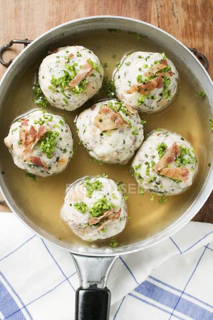 Clear broth with bacon dumplings — Stock Photo