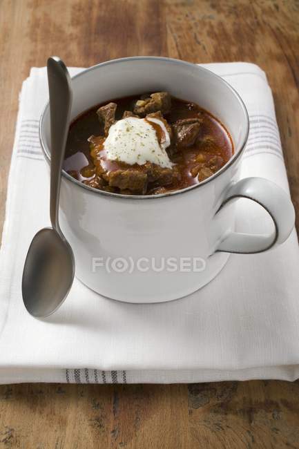 Goulash soup with sour cream — Stock Photo