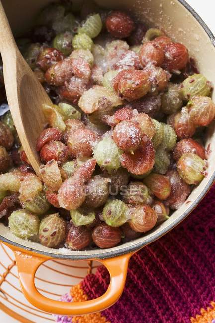 Sugared gooseberries in pan — Stock Photo