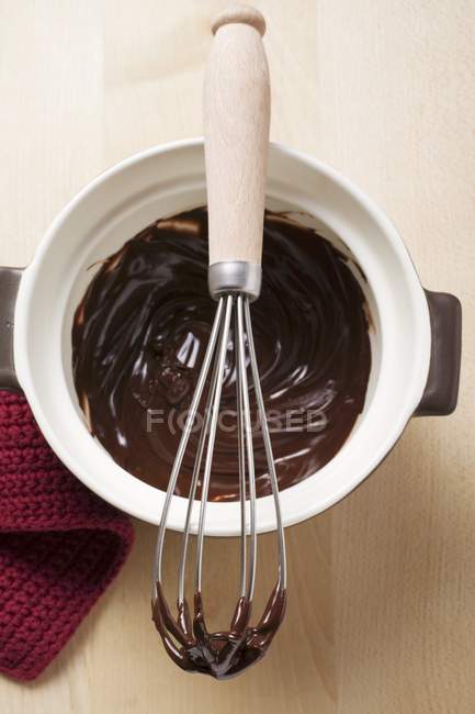 Chocolate sauce on whisk — Stock Photo