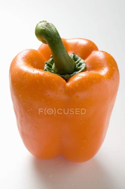 Orange pepper with drops of water — Stock Photo