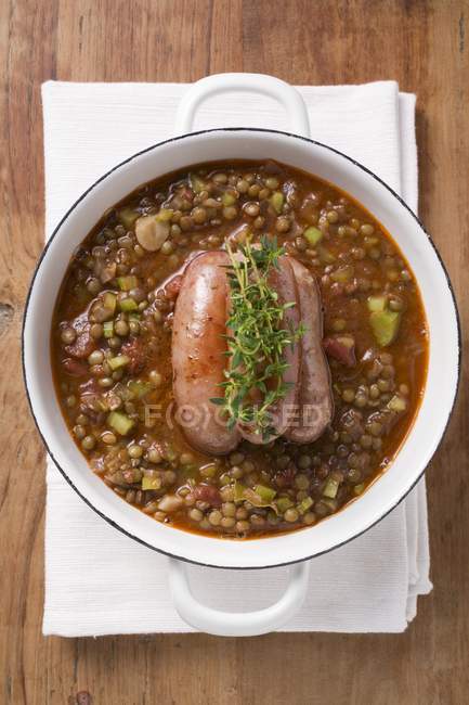 Lentil stew with sausages and thyme — Stock Photo