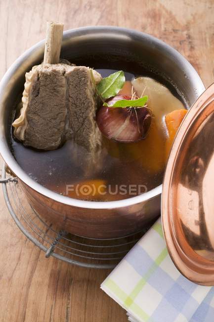 Broth with beef and soup vegetables — Stock Photo