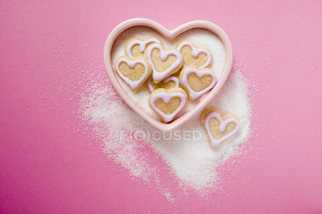 Heart-shaped biscuits in sugar bowl — Stock Photo