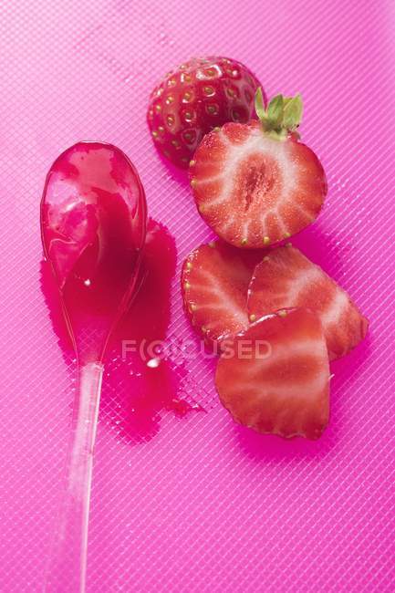 Strawberry jam on spoon — Stock Photo