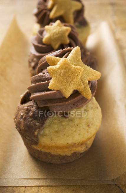 Christmas muffins on baking parchment — Stock Photo