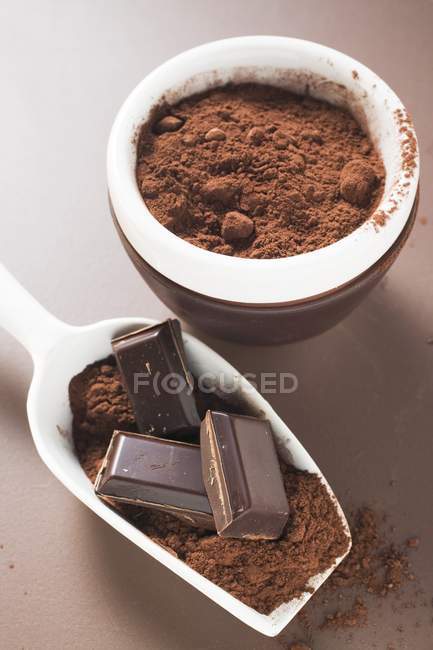 Chocolate and cocoa powder in scoop — Stock Photo