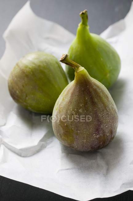 Three green fresh figs — Stock Photo