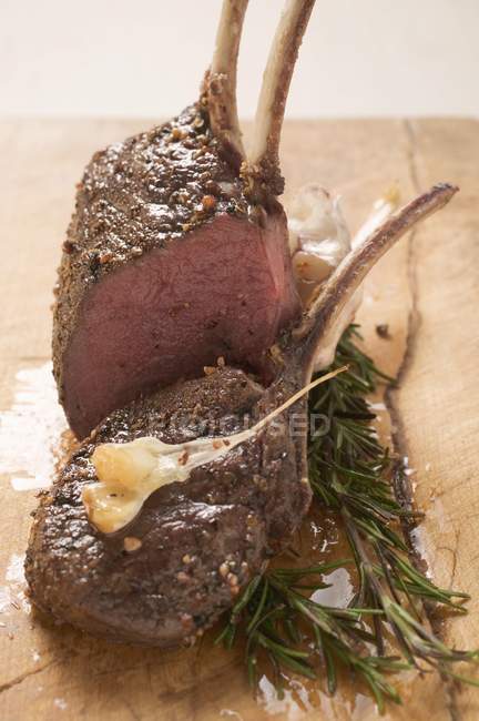 Rack of venison and rosemary — Stock Photo