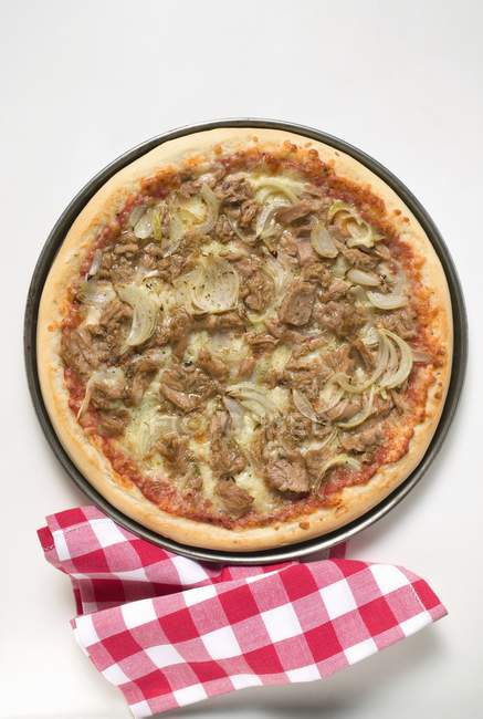 Napkin beside pizza — Stock Photo