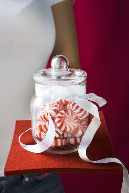 Cropped view of person holding jar of Starlite Mints — Stock Photo