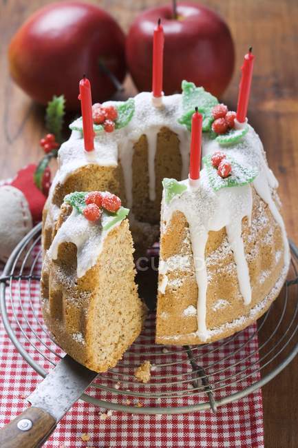 Walnut gugelhupf with candles for Christmas — Stock Photo