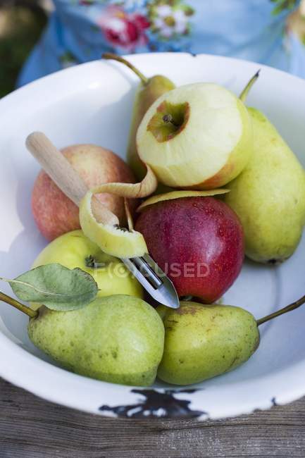 Apples whole and half-peeled — Stock Photo
