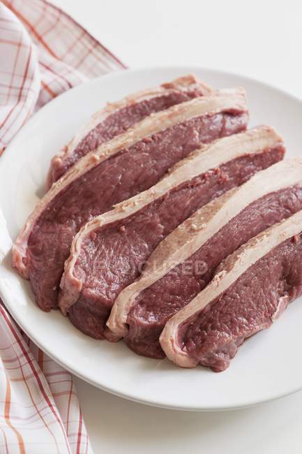 Beef rump steaks on plate — Stock Photo