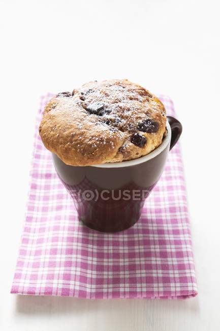 Closeup view of chocolate Panettone in espresso cup — Stock Photo