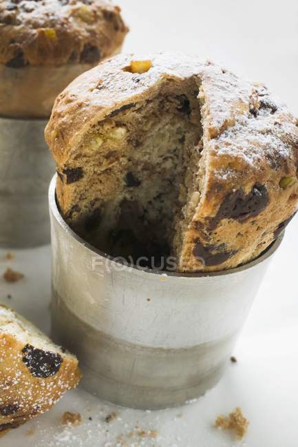 Closeup view of cut chocolate Panettone in baking tin — Stock Photo