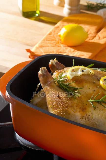 Whole Roasted chicken with rosemary and lemon — Stock Photo