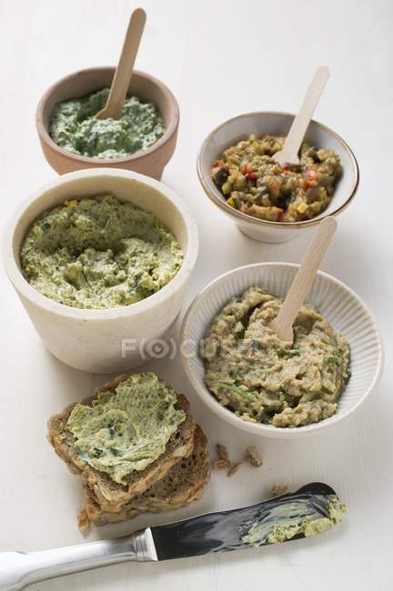 Assorted spreads with bread — Stock Photo