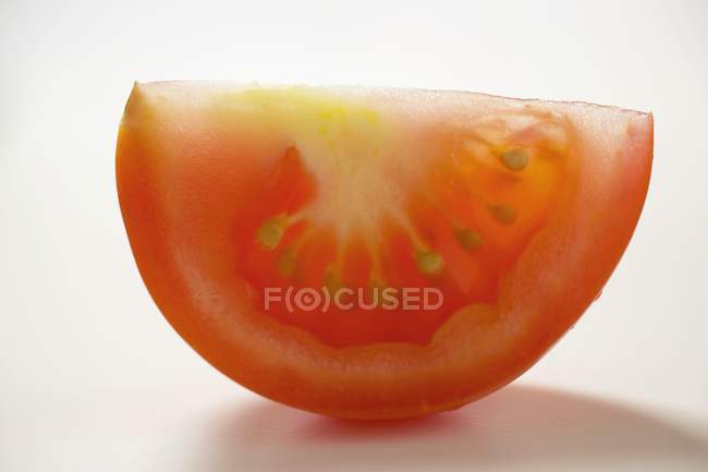 Red tomato wedge — Stock Photo