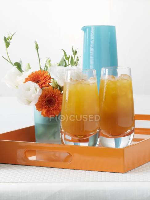 Apricot juice served in glasses — Stock Photo