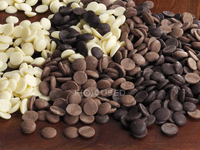 White with milk and dark Chocolate callets — Stock Photo