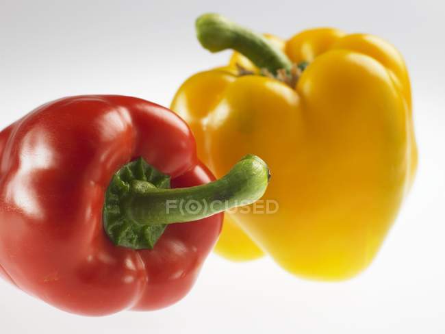 Red and a yellow peppers — Stock Photo
