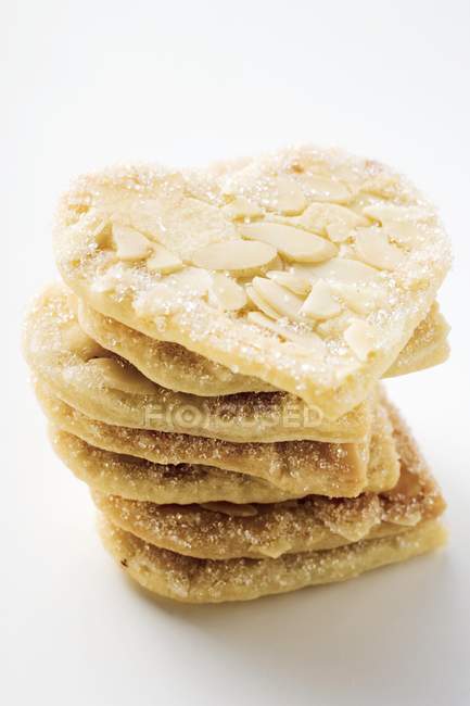 Closeup view of almond hearts with sugar in a pile — Stock Photo