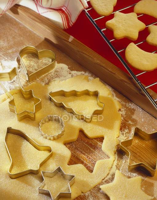 Closeup view of biscuit dough with cutters — Stock Photo