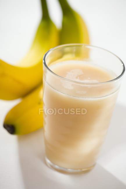 Glass of banana juice — Stock Photo