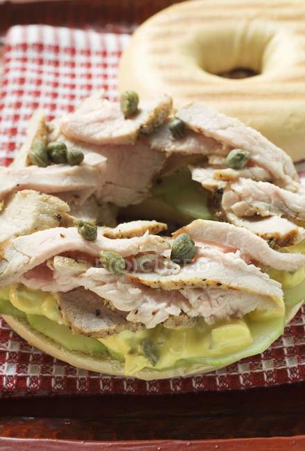 Bagel filled with pork — Stock Photo