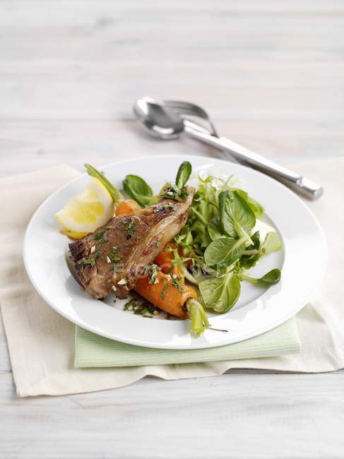 Lamb chop with carrots — Stock Photo