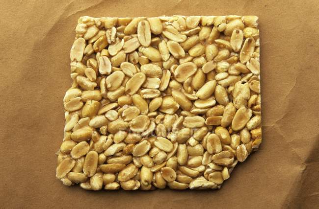 Peanut Brittle on paper — Stock Photo