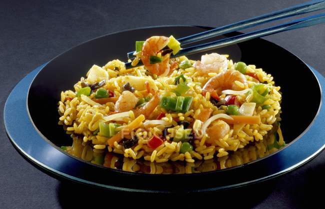 Nasi goreng dish of seafood and vegetables — Stock Photo