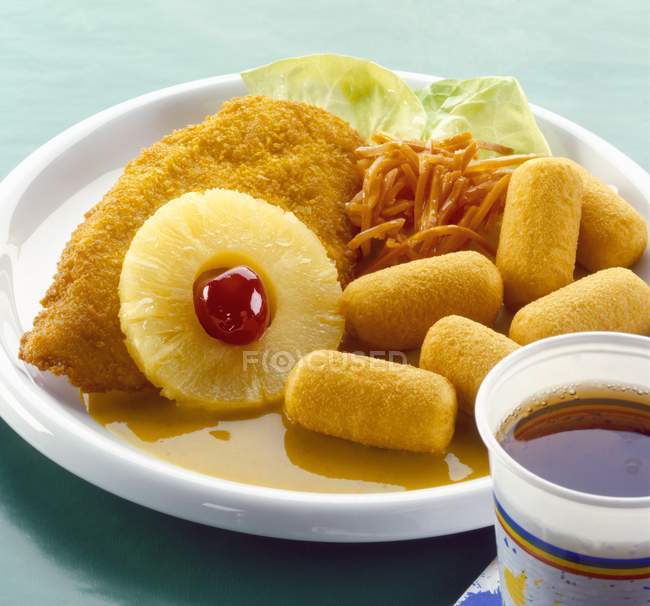 Closeup view of Hawaiian chicken escalope with pineapple ring and cherry — Stock Photo
