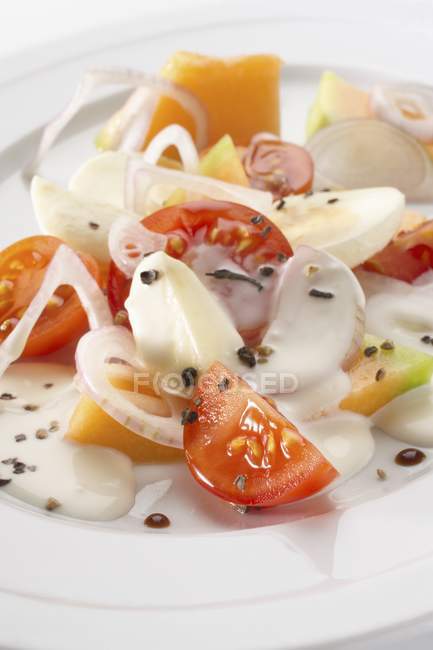 Melon and tomato salad — Stock Photo
