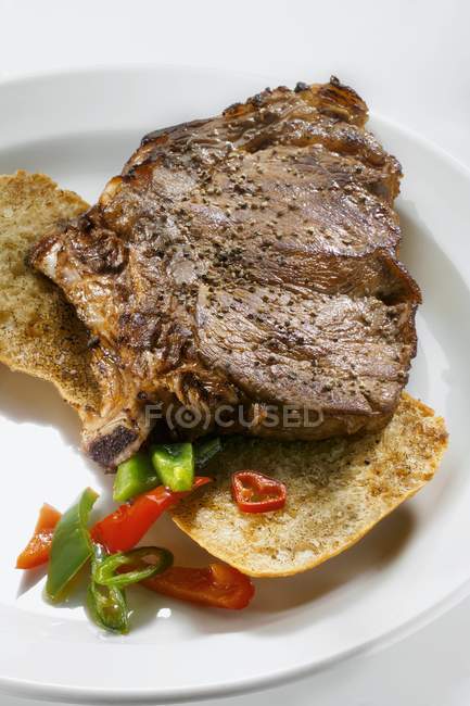 Seasoned steak with peppers — Stock Photo